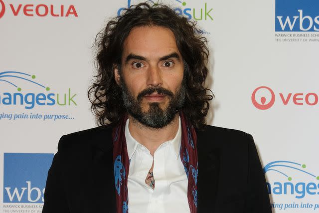 <p>MelMedia/Getty</p> Russell Brand attends the Fire and Ice Ball in December 2019.