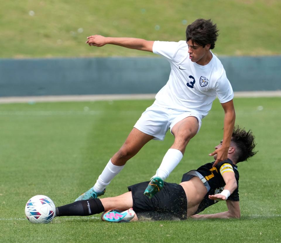Naples Stephen Cuebas (3) attempts to drive the ball down field during Class 5A Boys Soccer Championship match American Heritage at Spec Martin Stadium in DeLand, Saturday, Feb. 25, 2023 