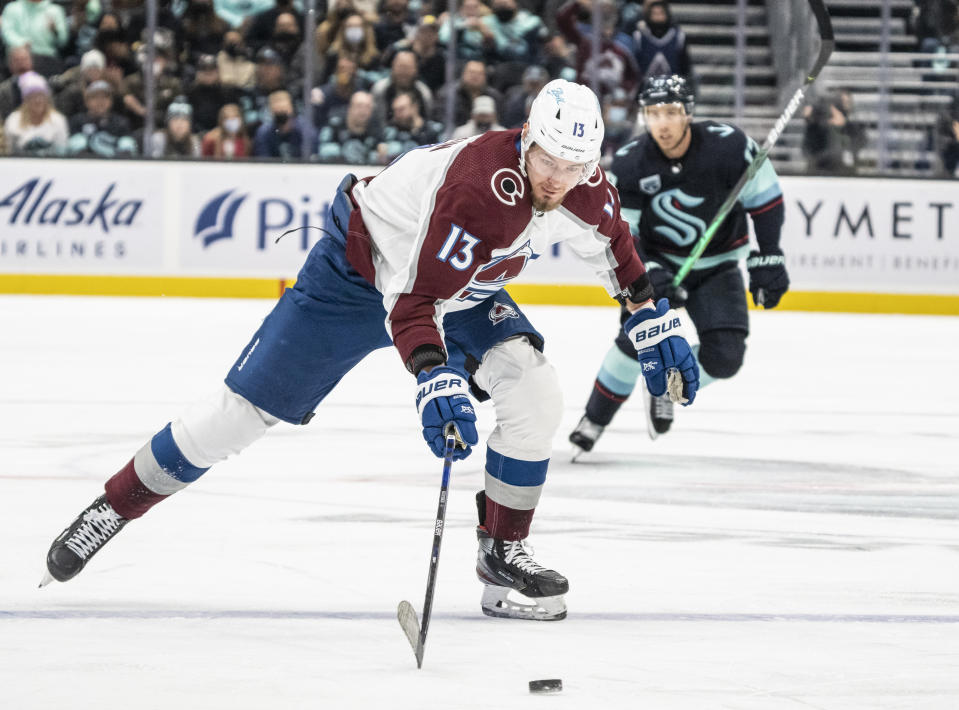 Colorado Avalanche right wing Valeri Nichushkin (13) breaks away for a short-handed goal during the first period of an NHL hockey game against the Seattle Kraken, Friday, Nov. 19, 2021, in Seattle. (AP Photo/Stephen Brashear)