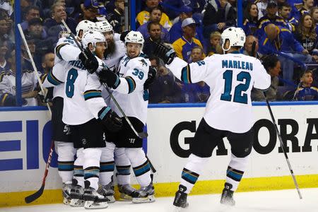 May 17, 2016; St. Louis, MO, USA; San Jose Sharks defenseman Brent Burns (88) is congratulated by teammates after scoring a gaol against St. Louis Blues goalie Brian Elliott (not pictured) during the second period in game two of the Western Conference Final of the 2016 Stanley Cup Playoff at Scottrade Center. Mandatory Credit: Billy Hurst-USA TODAY Sports