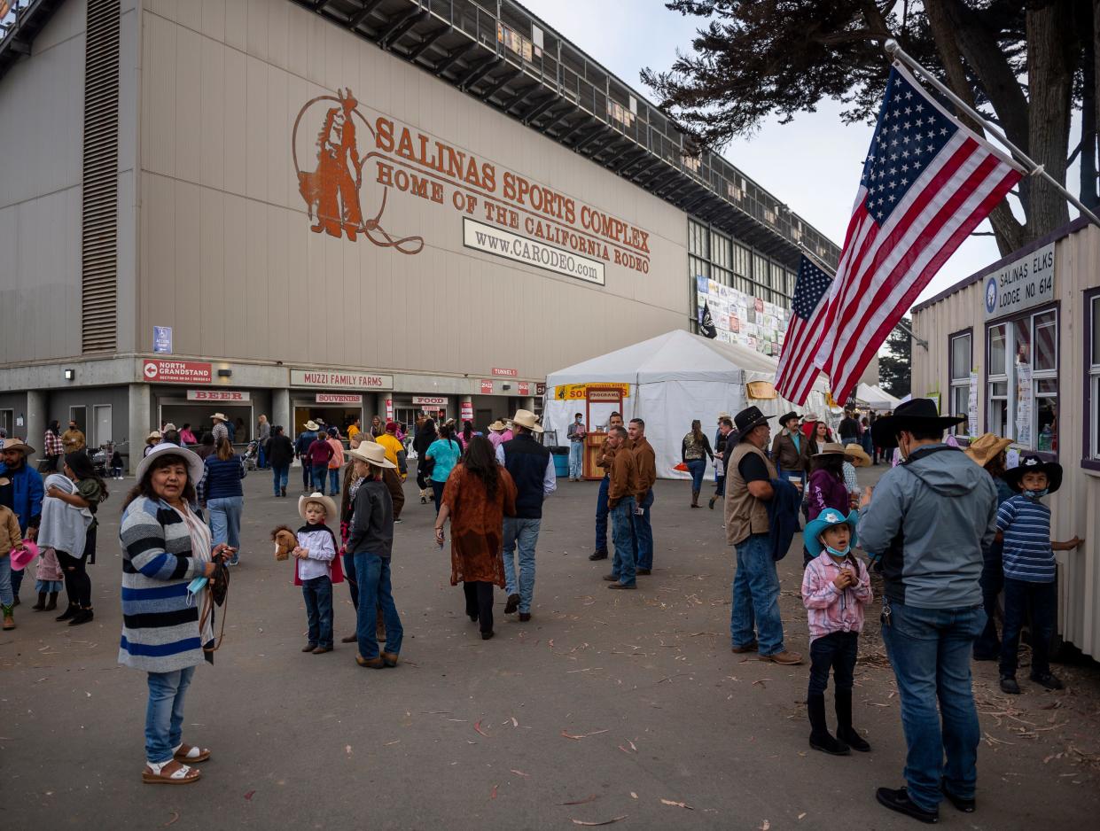 People make their way inside the Salinas Sports Complex for the California Rodeo Salinas in Salinas, Calif., on Thursday, Sept. 23, 2021. 