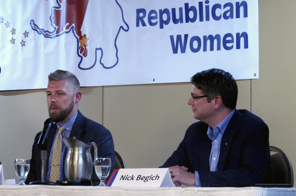 Republican Josh Revak, left, is shown on Monday, May 16, 2022, speaking at a forum in Juneau, Alaska, that was also attended by three other Republican candidates for Alaska's U.S. House seat, including Nick Begich, pictured at right. Revak and Begich are among 48 candidates in a June 11 special primary for the House seat left vacant by the death earlier this year of Republican Rep. Don Young. (AP Photo/Becky Bohrer)