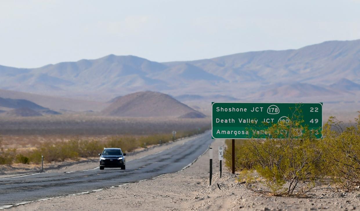 A vehicle drives through Death Valley, California, on July 11, 2021 as California where temperatures hit 120 degrees this weekend  as California is gripped in another heatwave. - Millions of people across the western United States and Canada were hit July 11, 2021, by a new round of scorching hot temperatures, with some roads closed, train traffic limited and new evacuations ordered. (Photo by Frederic J. BROWN / AFP) (Photo by FREDERIC J. BROWN/AFP via Getty Images)