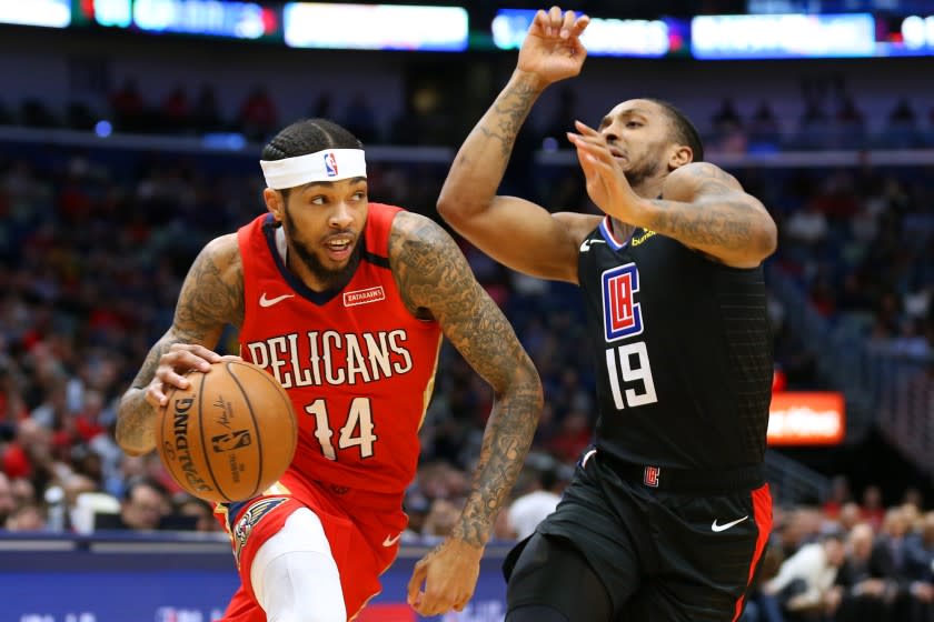 NEW ORLEANS, LOUISIANA - JANUARY 18: Brandon Ingram #14 of the New Orleans Pelicans drives against Rodney McGruder #19 of the LA Clippers during the first half at the Smoothie King Center on January 18, 2020 in New Orleans, Louisiana. NOTE TO USER: User expressly acknowledges and agrees that, by downloading and or using this Photograph, user is consenting to the terms and conditions of the Getty Images License Agreement. (Photo by Jonathan Bachman/Getty Images)