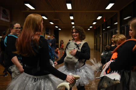 Lauren Hoffmann, 29, a college program manager, performs with her baby-wearing dance troupe in San Antonio, Texas, U.S., February 7, 2019. REUTERS/Callaghan O'Hare