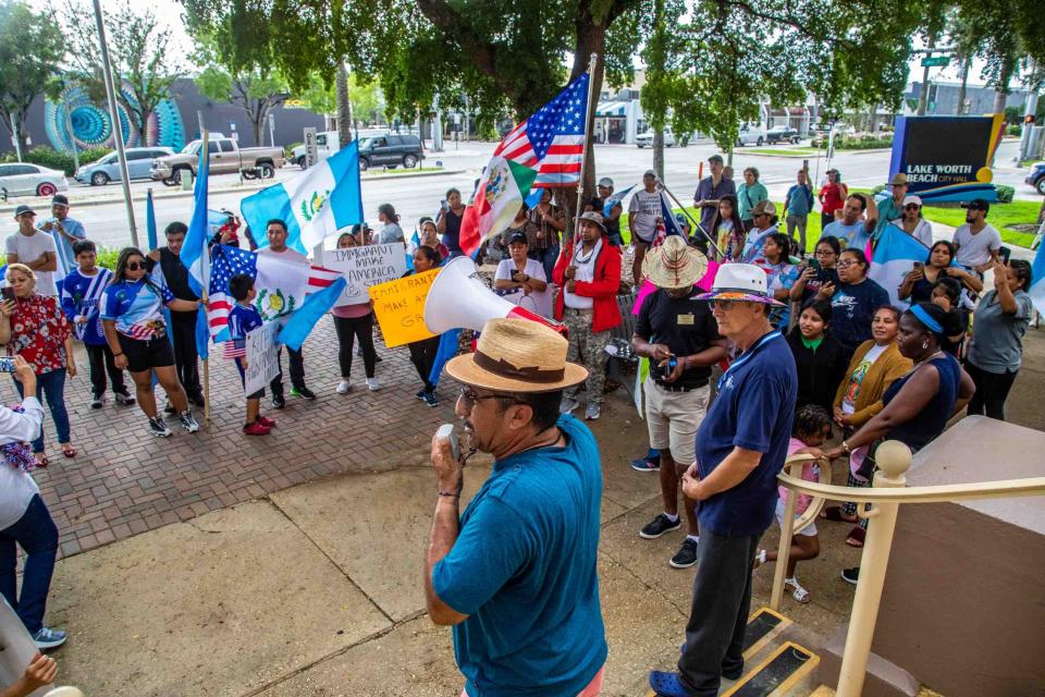 Community organizer Roberto Monjaras speaks to a rally Sunday at Lake Worth Beach City Hall to protest a new state immigration law.