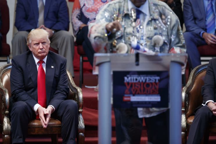 Donald Trump listens to Don King speak at campaign rally in Cleveland.