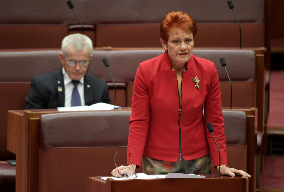 One Nation Senator Pauline Hanson and Senator Malcolm Roberts in the Senate at Parliament House.