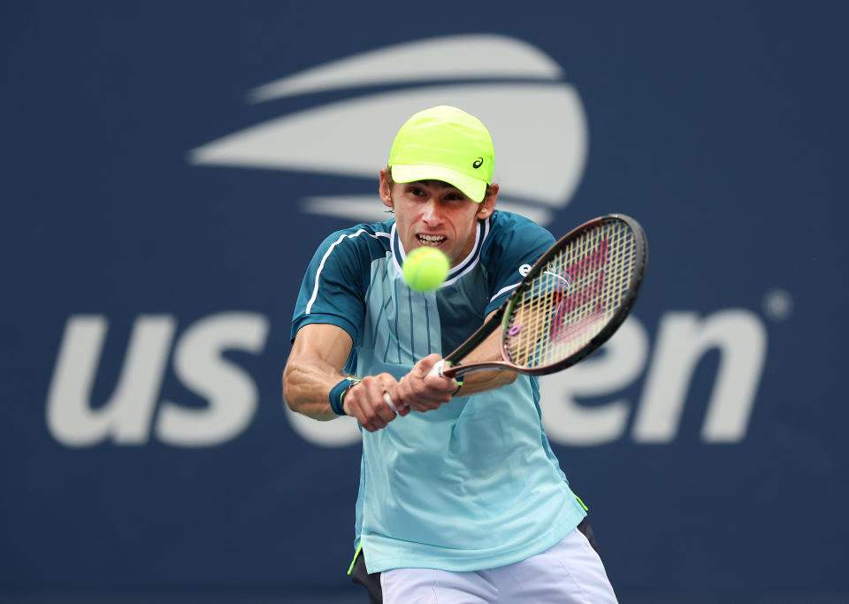 Alex De Minaur hits a backhand.