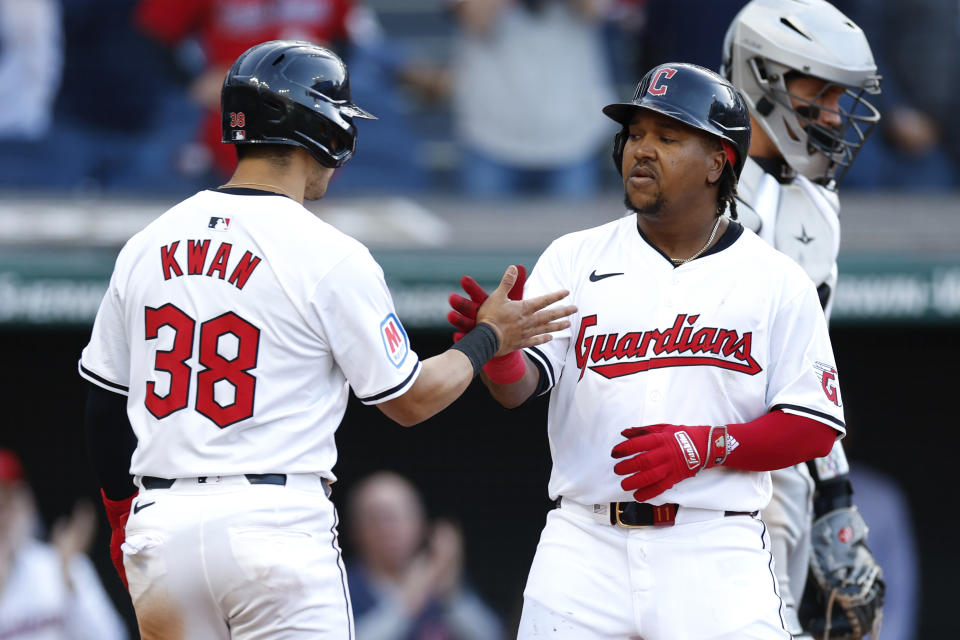 Cleveland Guardians' José Ramírez, front right, celebrates with Steven Kwan (38) after hitting a two-run home run off Chicago White Sox pitcher Bryan Shaw during the fifth inning of a baseball game, Monday, April 8, 2024, in Cleveland. (AP Photo/Ron Schwane)