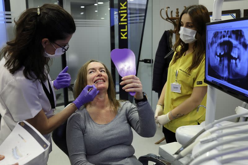 Marion Parks, a 55-year-old British woman, receives dental treatment in Istanbul