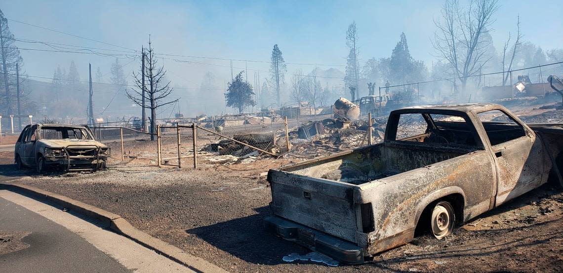 A neighborhood smolders after being destroyed by the Mill Fire in Weed, Calif. Friday, Sept. 2, 2022.