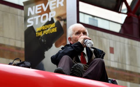 Phil Kingston, 83, said he was demonstrating over concerns for his grandchildren - Credit: Dylan Martinez/Reuters