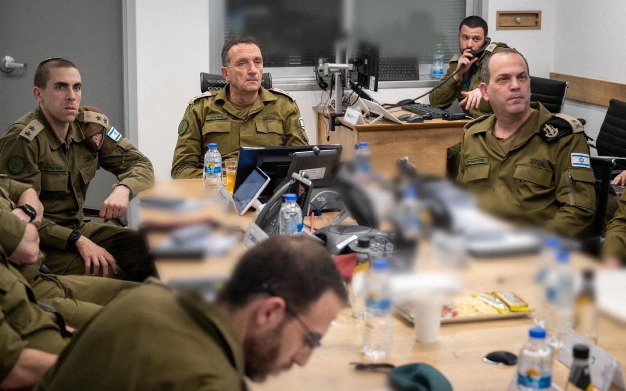 Israeli military Chief of General Staff Herzi Halevi, second from left, directs an operation from Tel Aviv in this partly blurred picture released on Sunday