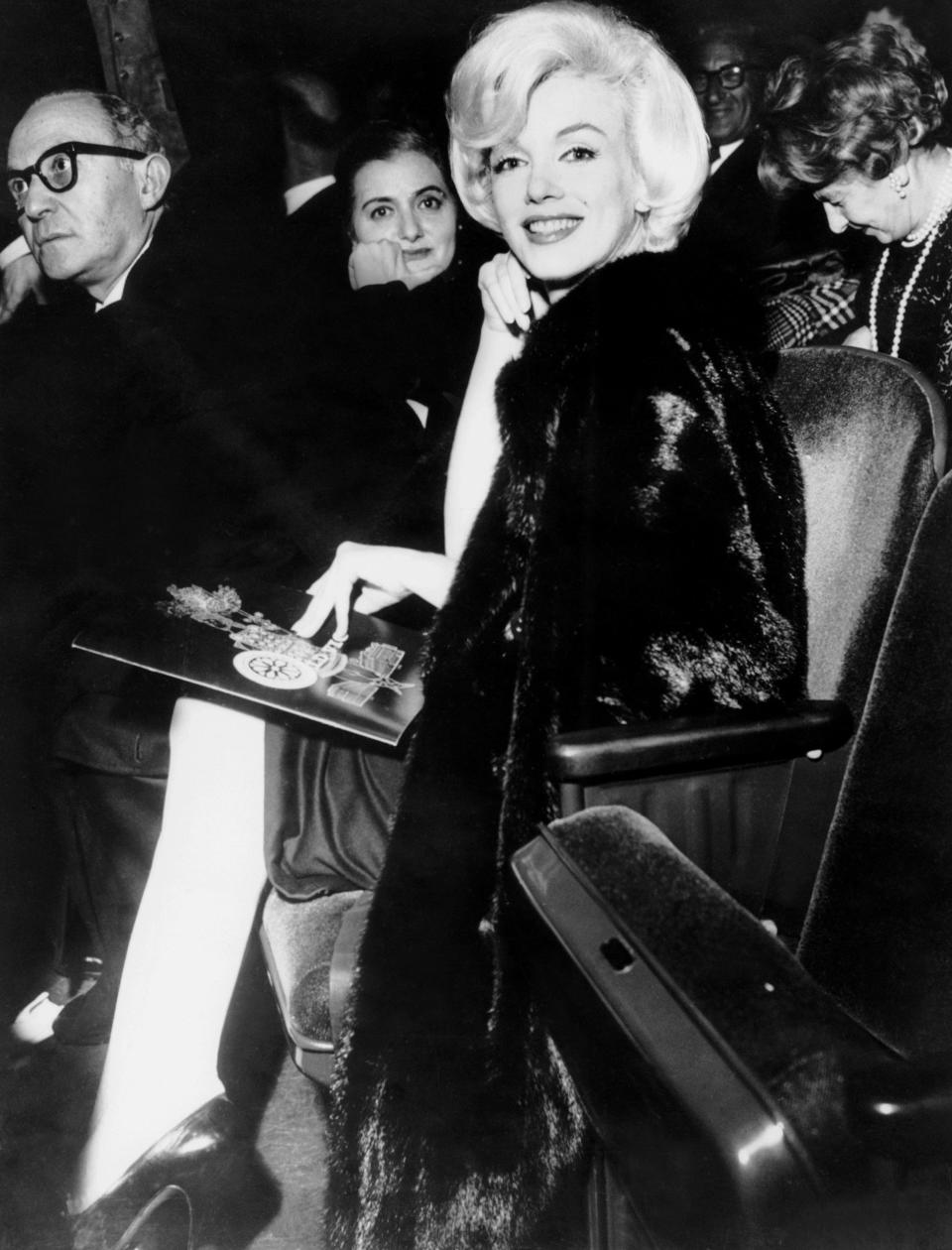 Lee Strasberg, left, Paula Strasberg, centre, and Marilyn Monroe at a performance of Macbeth in New York, 1962