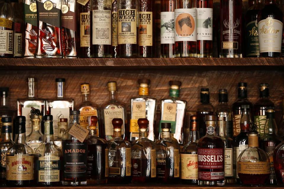 A selection of bourbon sat on shelves Tuesday at The Amsden Bourbon Bar in Versailles. The Amsden Bourbon Bar is open daily and features seasonal and classic cocktails.