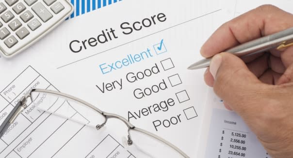 Excellent Credit Score with writing hand