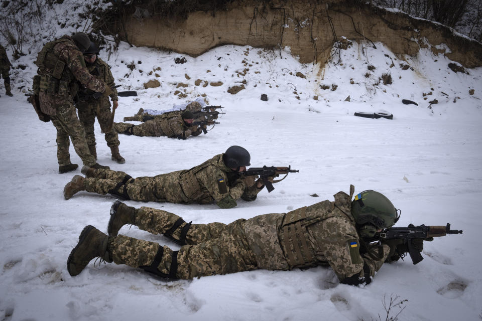 Members of the pro-Ukrainian Russian ethnic Siberian Battalion practice at a military training close to Kyiv, Ukraine, Wednesday, Dec. 13, 2023. Ukraine's military has formed a battalion of soldiers made up entirely of Russian citizens who want to fight against Russian invasion.(AP Photo/Efrem Lukatsky)