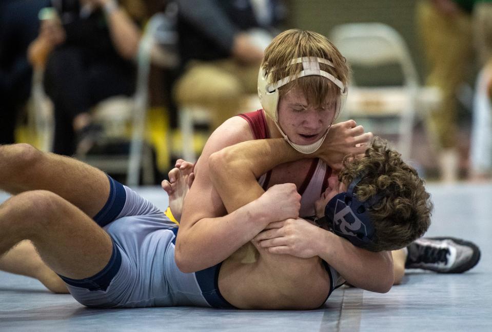 Evan Seng of Evansville Mater Dei and Zach Traylor of Evansville F.j. Reitz compete in the 126-pound championship match of the 2023 IHSAA Wrestling Sectional tournament at Central High School in Evansville, Ind., Saturday afternoon, Jan. 28, 2023.