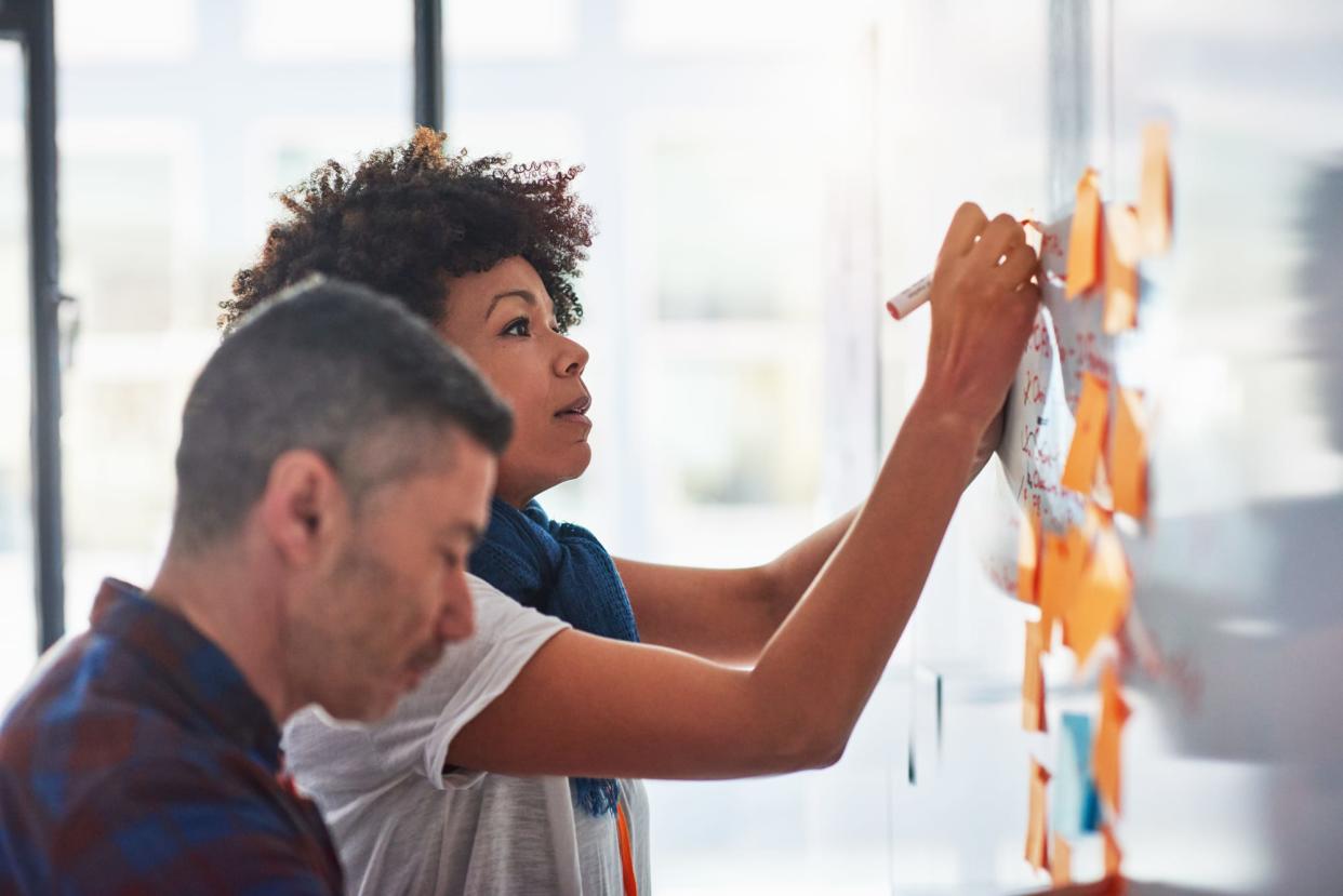 Colleagues brainstorming in a tech start-up office