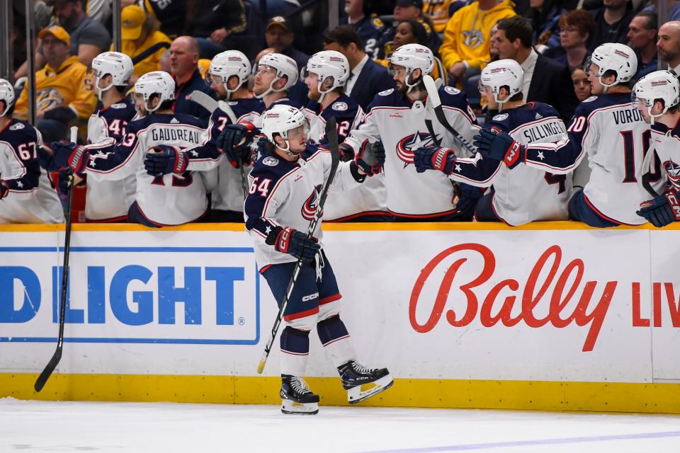 Apr 13, 2024; Nashville, Tennessee, USA; Columbus Blue Jackets right wing Trey Fix-Wolansky (64) celebrates his goal against the Nashville Predators during the third period at Bridgestone Arena. Mandatory Credit: Steve Roberts-USA TODAY Sports