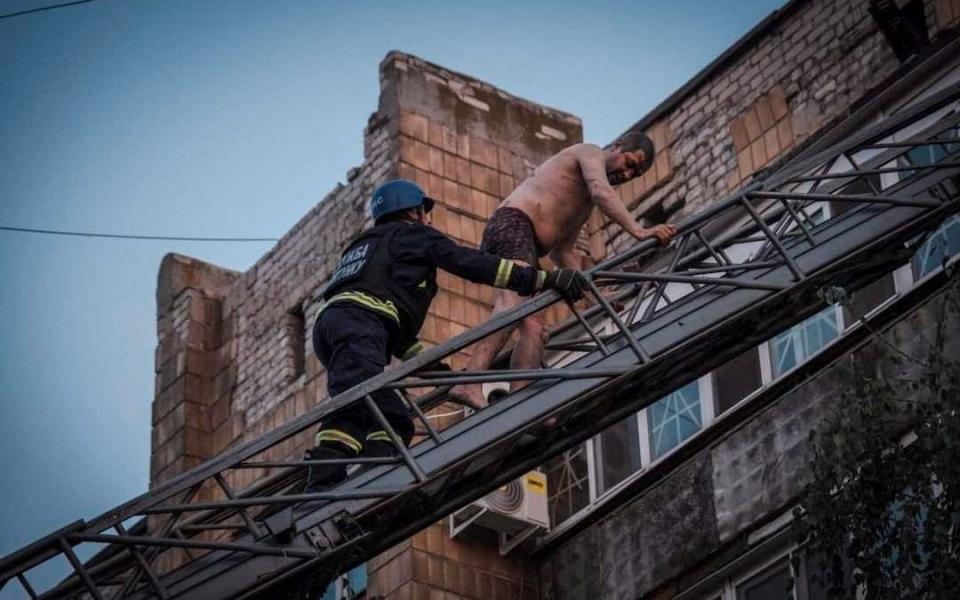 Rescuers work at the site where a building was destroyed during a Russian missile strike, amid Russia's attack on Ukraine, in Pokrovsk, Donetsk region, Ukraine August 7, 2023.