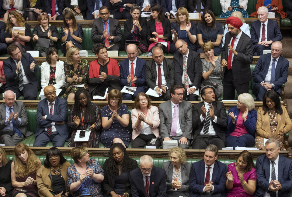 In this handout photo provided by the House of Commons, Labour MP Tanmanjeet Singh Dhesi, standing, speaks during Boris Johnson's first Prime Minister's Questions, in the House of Commons in London, Wednesday, Sept. 4, 2019. A lawmaker for Britain's opposition Labour Party has gotten an unusual round of applause after challenging Prime Minister Boris Johnson to apologize for comparing Muslim women who wear face-covering veils to "letter boxes." Dhesi asked Johnson to say he was sorry for the "derogatory and divisive" remarks in a newspaper column. (Jessica Taylor/House of Commons via AP)