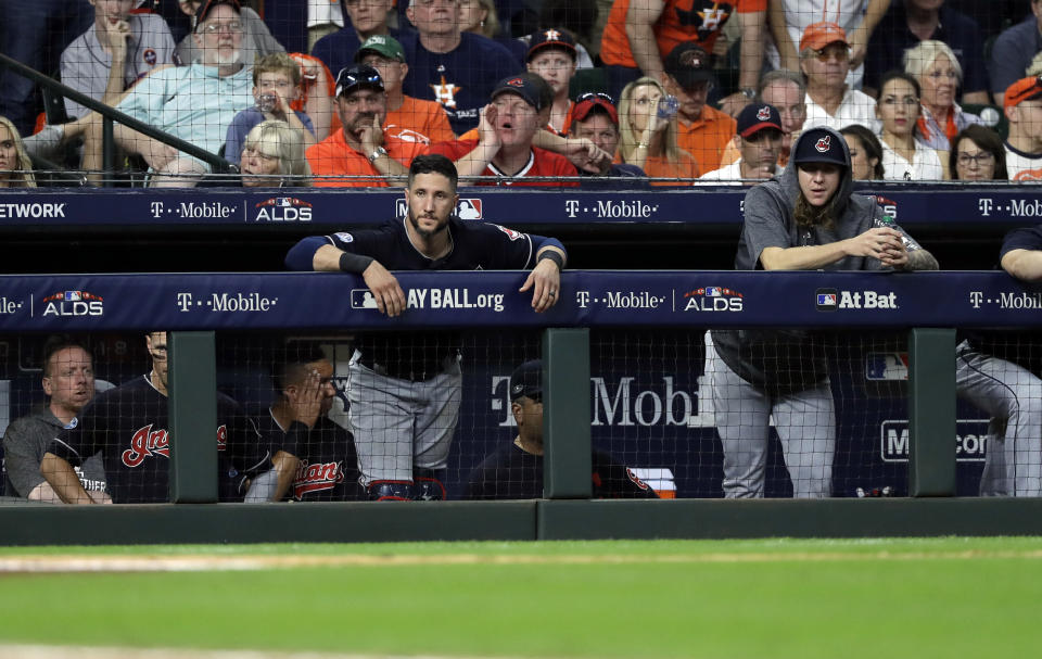 Cleveland Indians players stand in the dugout as they fall to the Houston Astros in Game 2 of a baseball American League Division Series, Saturday, Oct. 6, 2018, in Houston. (AP Photo/David J. Phillip)