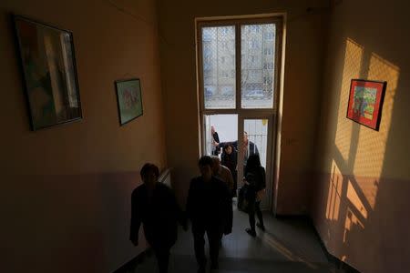 Poeple arrive at a polling station during parliamentary elections in Sofia, Bulgaria March 26, 2017. REUTERS/Laszlo Balogh