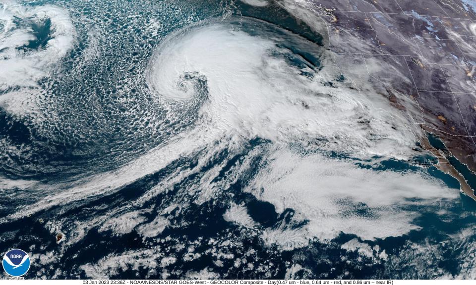 satellite image shows giant swirl of clouds just off the coast of california about to engulf the state