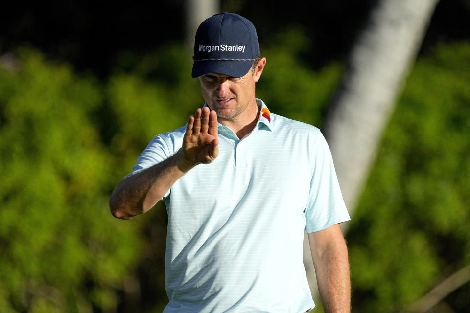 Justin Rose lines up his shot on the third green during the pro-am round at the Sony Open golf event, Wednesday, Jan. 10, 2024, at Waialae Country Club in Honolulu. (AP Photo/Matt York)