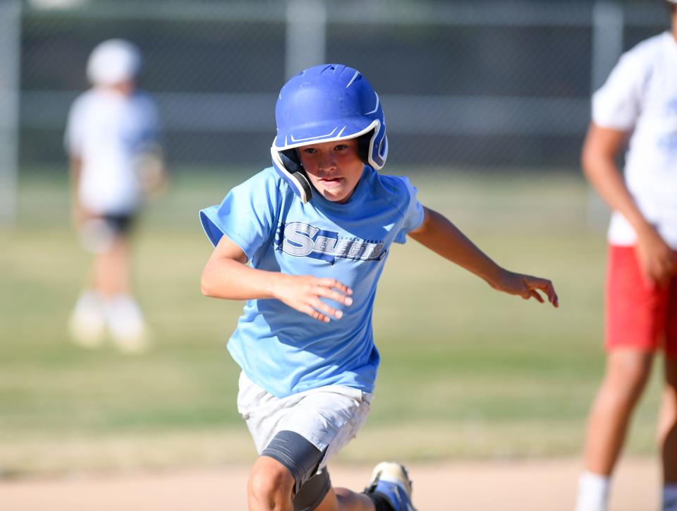 Henrik Kortan (#34) runs to third base during Little League practice on Monday, August 1, 2022, at Cherry Rock Park in Sioux Falls.