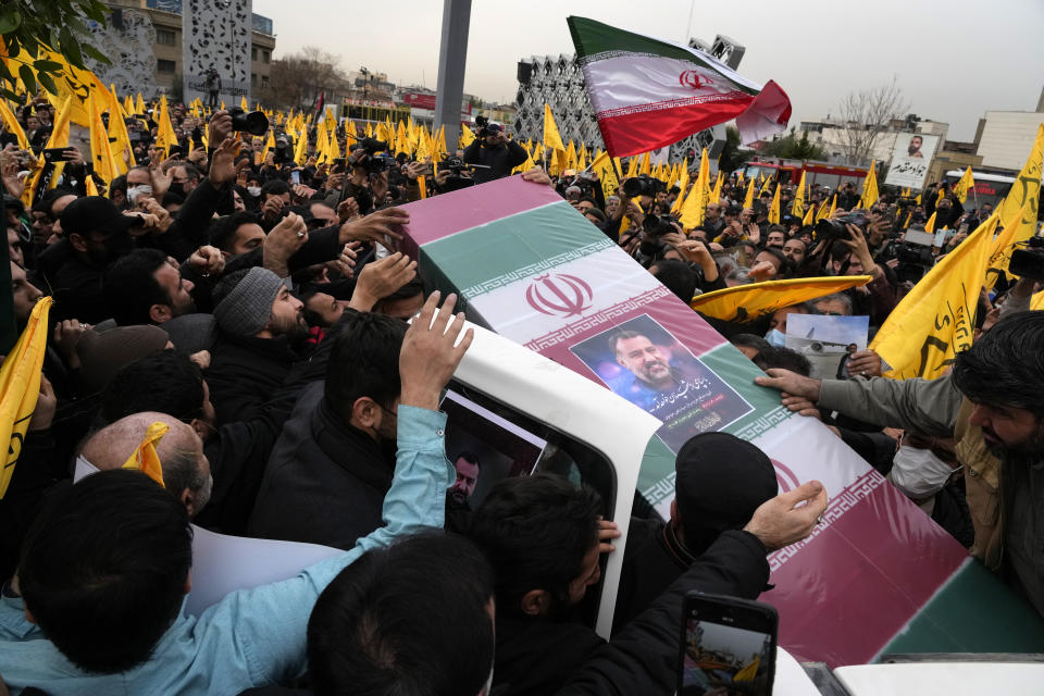 FILE - Iranian mourners carry the flag-draped coffin of Seyed Razi Mousavi, a high ranking Iranian general of the paramilitary Revolutionary Guard, who was killed in an alleged Israeli airstrike in Syria on Monday, during his funeral ceremony in Tehran, Iran, Thursday, Dec. 28, 2023. Prime Minister Benjamin Netanyahu and other Israeli leaders have repeatedly threatened to kill Hamas leaders following the group's deadly Oct. 7 cross-border attack that sparked the war in Gaza. Israel has a long history of assassinating its enemies, many carried out with precision airstrikes. (AP Photo/Vahid Salemi, File)