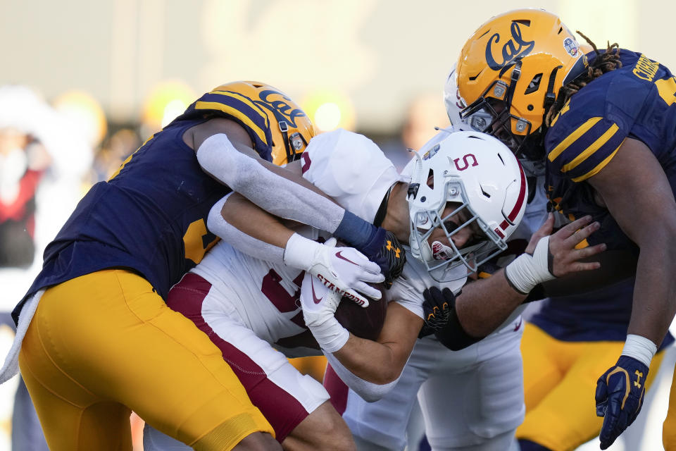 FILE - Stanford running back Mitch Leigber, middle, runs the ball against California during the first half of an NCAA college football game in Berkeley, Calif., Saturday, Nov. 19, 2022. Atlantic Coast Conference presidents and chancellors held a conference call Tuesday, Aug. 8, 2023, but took no action on West Coast expansion with California and Stanford, a person with knowledge of the situation told The Associated Press. (AP Photo/Godofredo A. Vásquez, File)