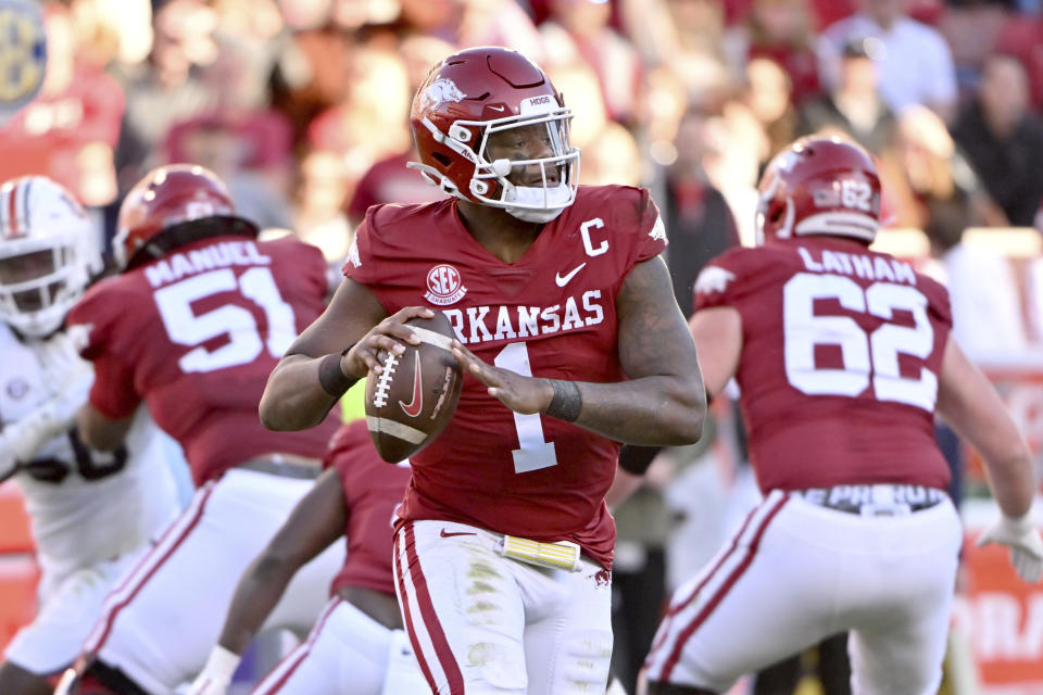 Arkansas quarterback KJ Jefferson (1) rolls out to pass against Auburn during an NCAA college football game Saturday, Nov. 11, 2023, in Fayetteville, Ark. (AP Photo/Michael Woods)