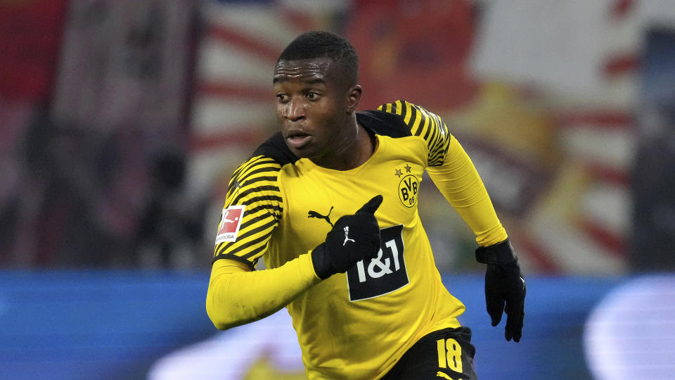 FILE -- Dortmund's Youssoufa Moukoko runs during the German Bundesliga soccer match between RB Leipzig and Borussia Dortmund in Leipzig, Germany, Saturday, Nov. 6, 2021. Germany is taking 17-year-old striker Youssoufa Moukoko to the World Cup, Coach Hansi Flick named his 26-man squad for Qatar on Thursday, rewarding Moukoko for scoring six goals and setting up four more in 13 Bundesliga appearances this season. (AP Photo/Michael Sohn, file)
