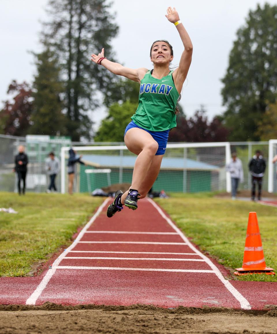 McKay's Stephanie Urenda competes in long jump in the MVC district track and field meet on Thursday, May 12, 2022 at McKay High School in Salem, Ore.