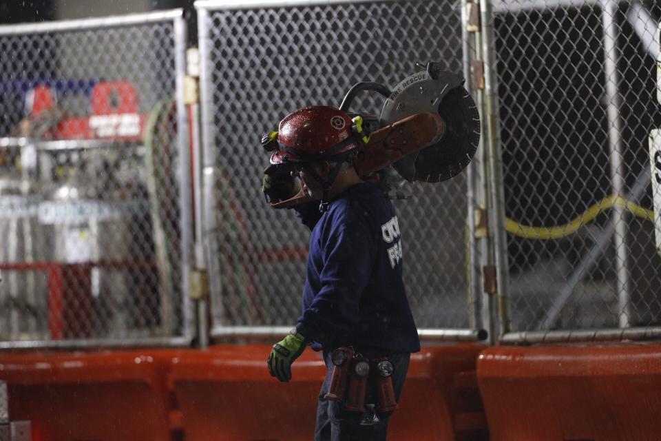 Crews continued to work through the night at W. 4th Street between Race and Elm in downtown Cincinnati on Tuesday, Nov. 26, 2019.