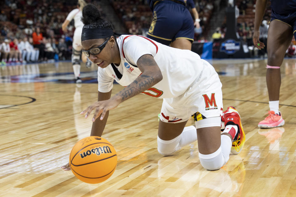 Maryland's Shyanne Sellers (0) goes for a loose ball against Notre Dame in the second half of a Sweet 16 college basketball game of the NCAA Tournament in Greenville, S.C., Saturday, March 25, 2023. (AP Photo/Mic Smith)