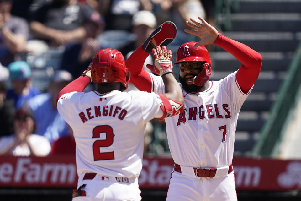 Los Angeles Angels' Luis Rengifo, left, celebrates his two-run home run with Jo Adell, who also scored, during the fifth inning of a baseball game against the Minnesota Twins, Sunday, April 28, 2024, in Anaheim, Calif. (AP Photo/Ryan Sun)