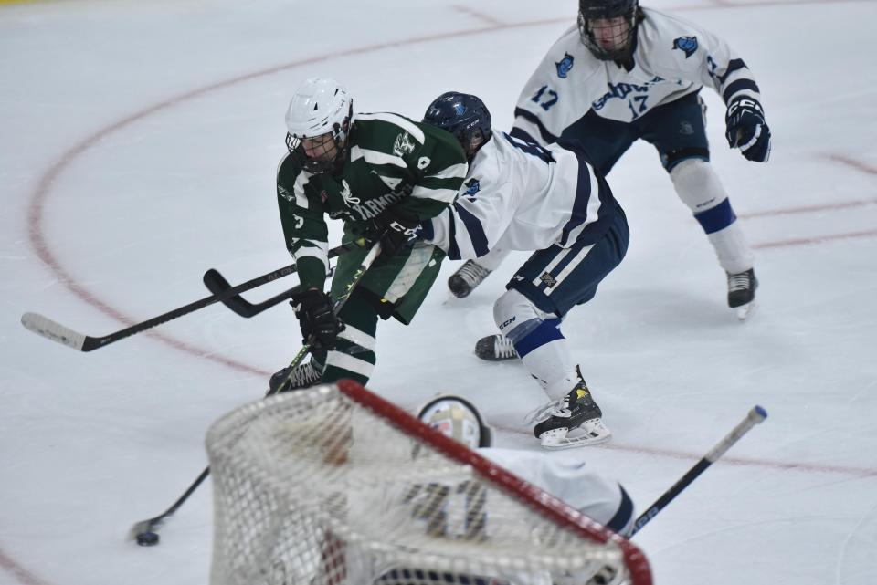 D-Y's Cam Cavatorta takes aim at Sandwich goalie Mitchell Norkevicius as Dennis-Yarmouth/Cape Cod Tech/Cape Cod Academy and Sandwich met in tournament hockey action at Gallo Arena on Thursday night. Sandwich won the game 4-1 and will be back in action at Gallo on Saturday against Nantucket in a semi-final match-up.