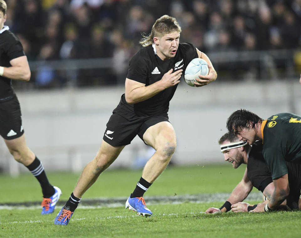 New Zealand's Jack Goodhue carries the ball against South Africa during a Rugby Championship match between the All Blacks and South Africa in Wellington, New Zealand, Saturday, July 27, 2019. (AP Photo/Ross Setford)