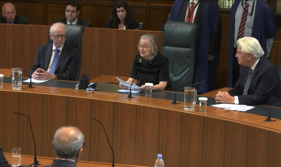 In this image taken from video made available by the Supreme Court in London on Tuesday Sept. 24, 2019, senior judge Brenda Hale reads a ruling. In a setback for Prime Minister Boris Johnson, Britain's Supreme Court has ruled that the suspension of Parliament was illegal. The ruling Tuesday is a major blow to the prime minister who had suspended Parliament for five weeks, claiming it was a routine closure. (Supreme Court via AP)