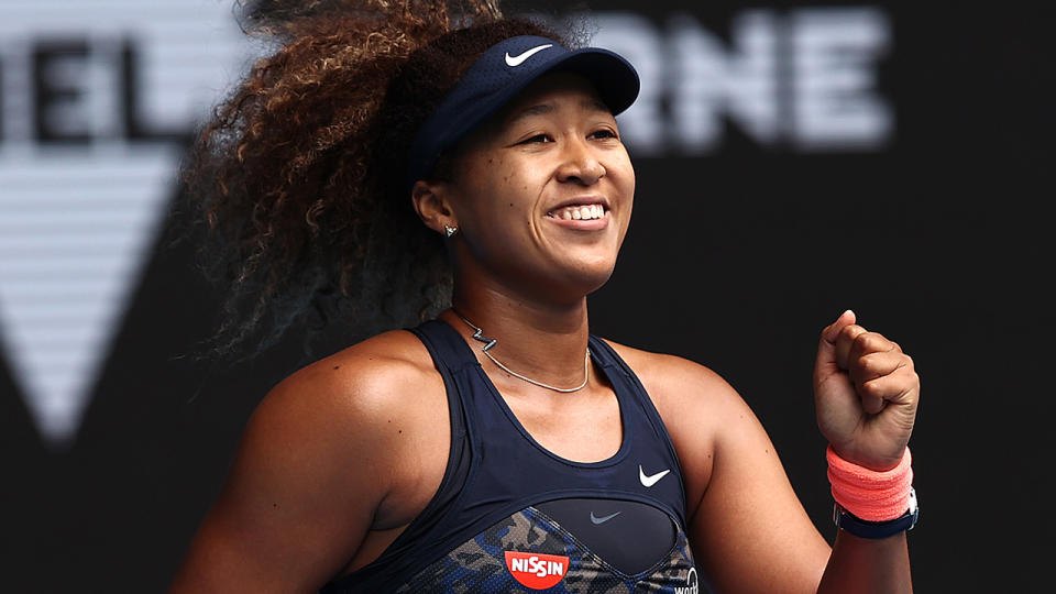 Naomi Osaka celebrates after winning match point in her fourth round match against Garbine Muguruza of Spain. (Photo by Cameron Spencer/Getty Images)