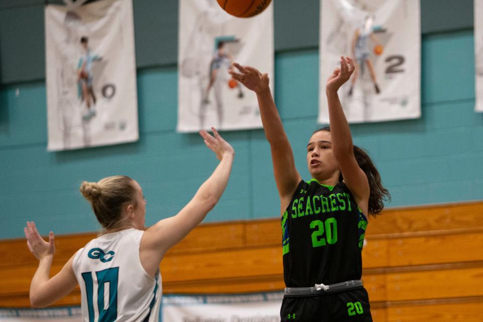 Seacrest Country Day's Madison D'Elia (20) shoots over Gulf Coast's Katie Ambrose (10) during the high school varsity girls basketball game between Seacrest and Gulf Coast, Saturday, Jan. 15, 2022, at Gulf Coast High School in Naples, Fla.Gulf Coast defeated Seacrest Country Day 71-31.