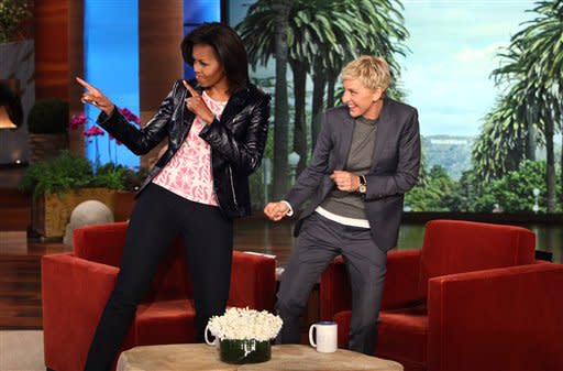 In this photo released by Warner Bros., talk show host Ellen DeGeneres is shown with first lady Michelle Obama during a taping of “The Ellen DeGeneres Show” on Wednesday, Feb. 1, 2012 in Burbank, Calif. This episode will air on Thursday, Feb. 2. (AP Photo/Warner Bros., Michael Rozman)