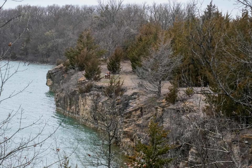 Trails traverse the edge of Elks Lake, giving wide views of the blue water and through the wooded lands as part of the Lehigh Portland Trail system.