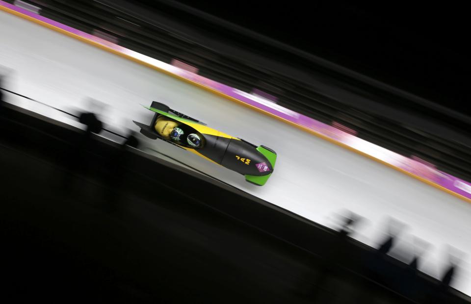 Jamaica's Winston Watts and Marvin Dixon speed down the track during the two-man bobsleigh event at the 2014 Sochi Winter Olympics, at the Sanki Sliding Center in Rosa Khutor February 16, 2014. REUTERS/Fabrizio Bensch (RUSSIA - Tags: SPORT BOBSLEIGH OLYMPICS)