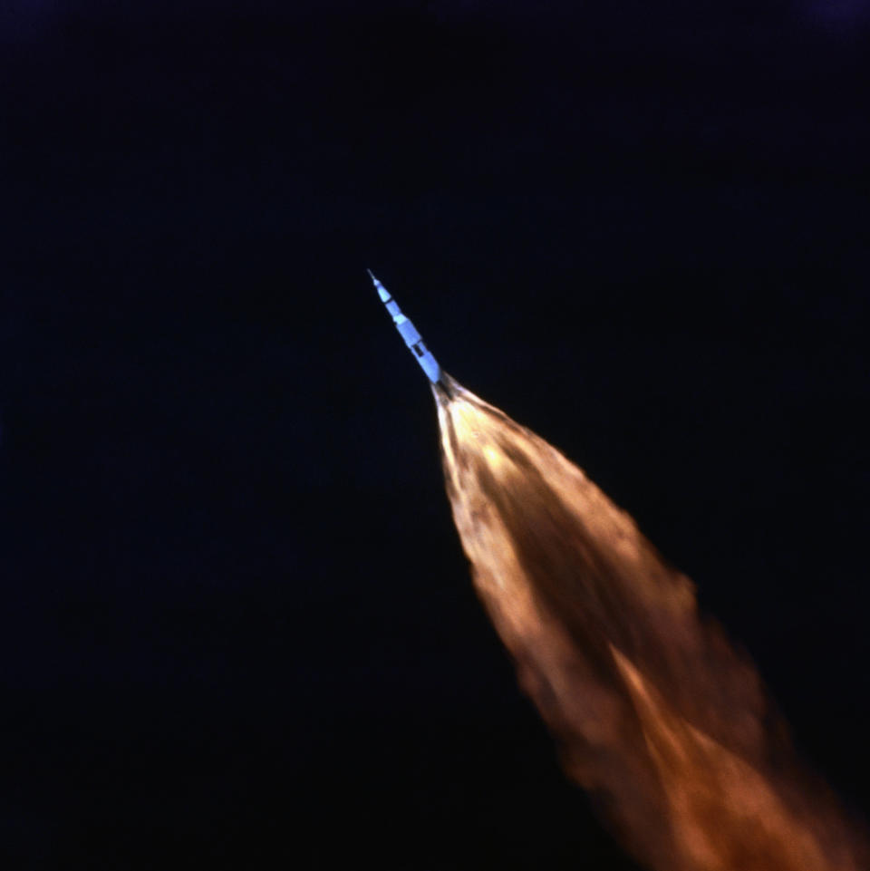 Tracking camera follows Saturn V shortly after July 16th moon launch here. Flames jet from booster rocket, as Apollo 11 craft streaks across the sky. (Photo: NASA/Bettmann Archive/Getty Images)