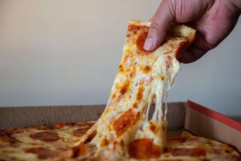 A Casey's pizza with pepperoni and extra cheese — the ingredient that's driving down the chain's profit margin on prepared foods.